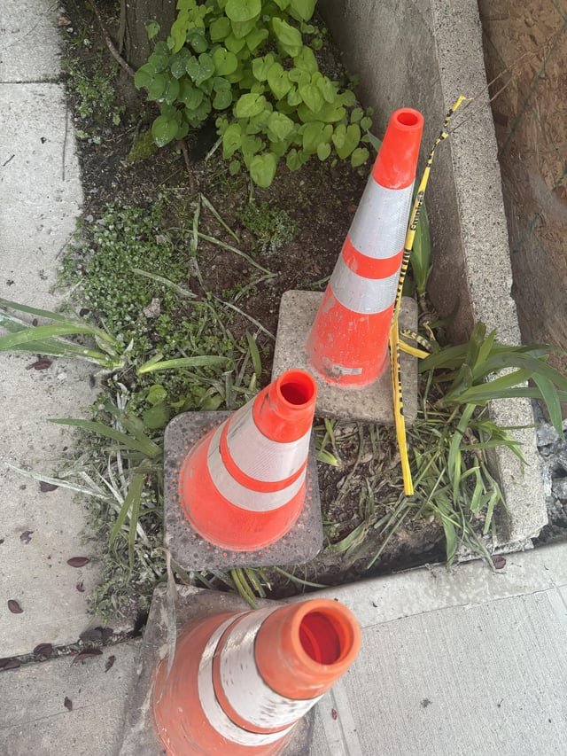 Where do I report construction destroying my front landscaping?