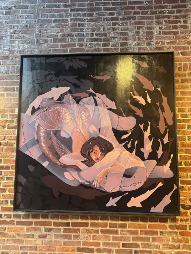 am I crazy or does this mural in pioneer square look like a thic mermaid throwing it back?