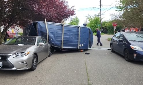 UPDATE:  Stolen-van-on-side crash at 15th/Henderson