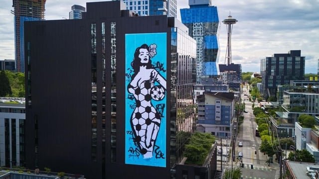 Seattle artist unveils 8-story mural celebrating city’s global soccer role