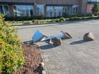 Someone already destroyed the planter barriers off of Aurora