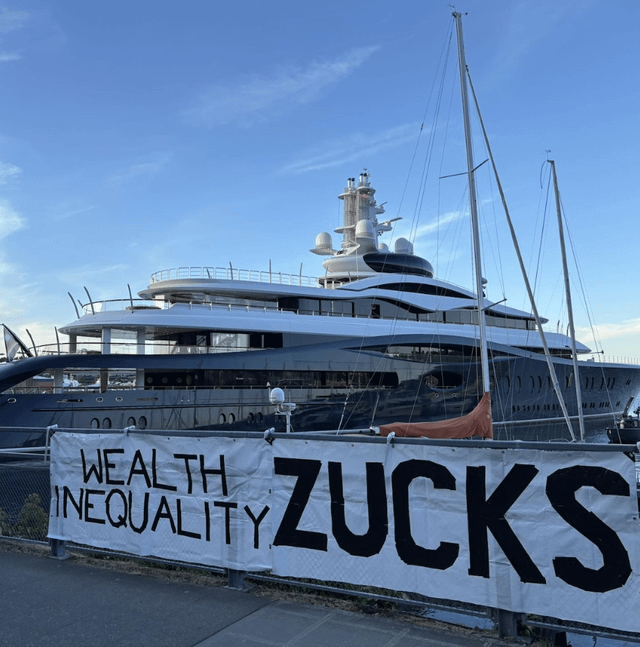 Seattle gives Mark Zuckerberg a proper welcome when he pulled up in his megayacht the day after firing 1,400 area jobs at Meta. One local artist set up an easel on the dock and painted Zuck’s yacht engulfed in flames