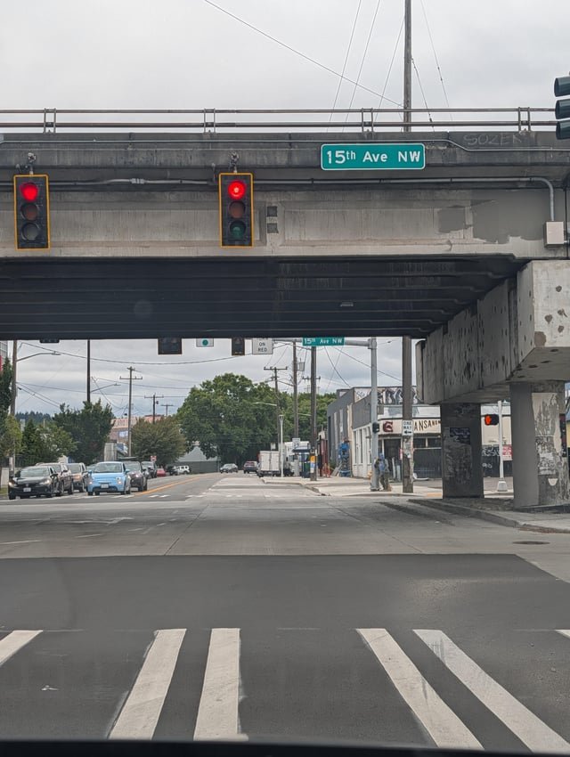 No turn on red signs at 15th and Leary are on the wrong side of the bridge
