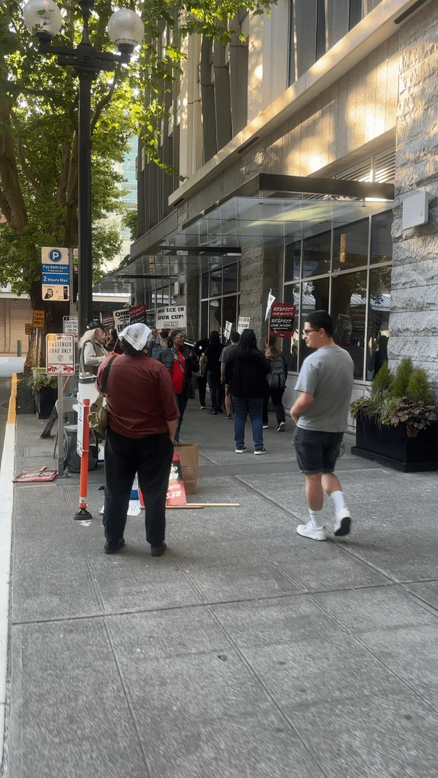 Embassy Suites workers picketing for better contract and better protections from ICE, on the morning of the World Cup