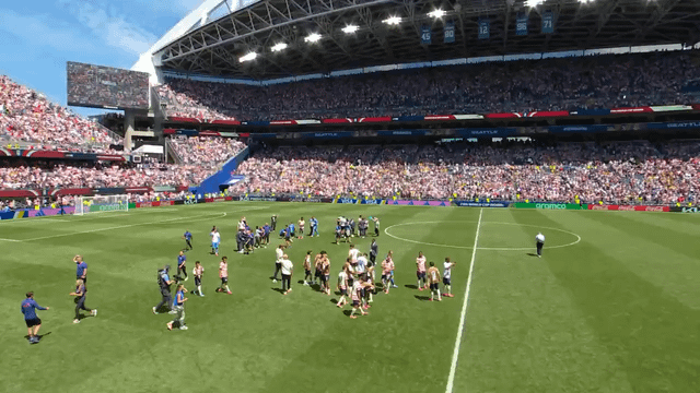 The crowd in Seattle singing Take Me Home, Country Roads by John Denver following the 2-0 victory by the U.S. over Australia