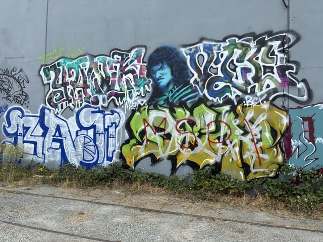 Weird Al mural behind Jack’s BBQ on Airport Way
