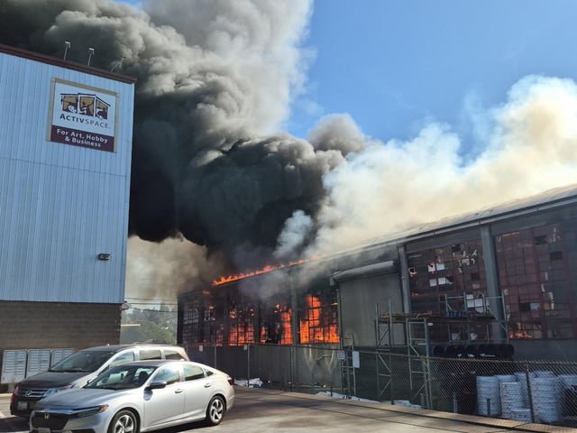 Plumbing building fire in Ballard