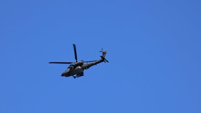 Anyone know what the Army Air Force Navy helicopter is doing hovering over Pioneer Square in circles?