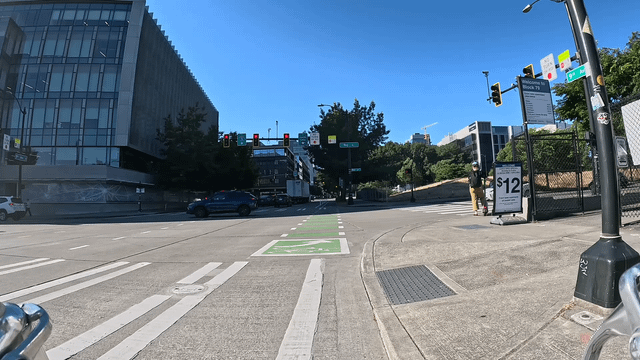 Sometimes I’m surprised Seattle drivers don’t kill more people: check out this red light runner almost hit a scooter rider in the crosswalk today. (9th Ave N and Roy St.)