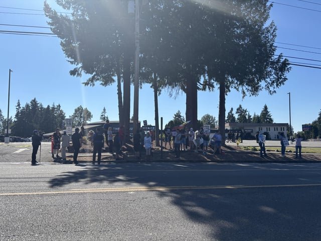 About 40 protesters and counterprotesters in front of Pursuit Church Kirkland where Erika Kirk is speaking tonight