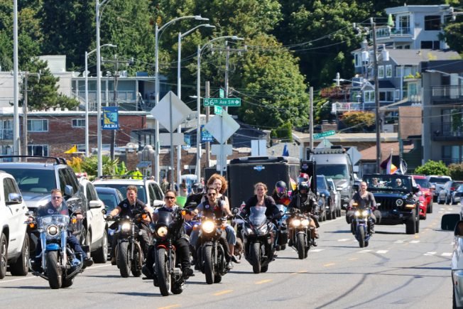 VIDEO: Beach breezes blow a component of Alki Beach Pride flag celebration off course, but party stays on track