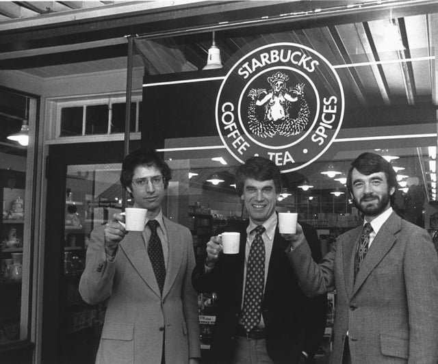 Starbucks founders posing outside their original store in Seattle, 1979.