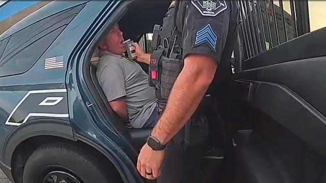 Cop who passed out at intersection suspended for only four days