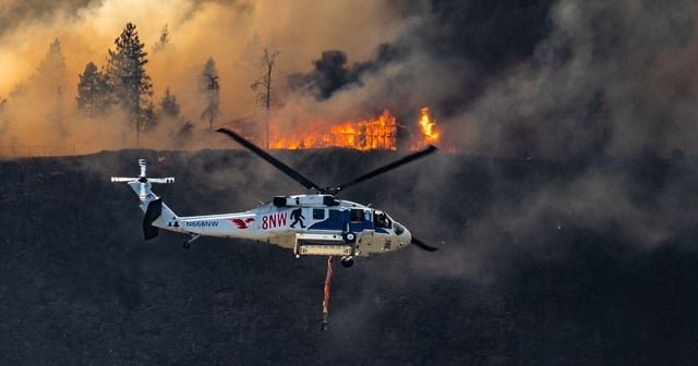 Thousands evacuated in north Spokane as wildfire crosses river into city