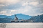 USS Ronald Reagan (CVN-76), a Nimitz-class nuclear-powered supercarrier, exiting Rich Passage off Alki Beach at high tide today bound for sea trials after spending the past two years getting extensive renovations at Bremerton Naval Shipyard: