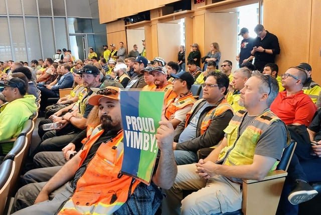 Housing Advocates, Workers Pack City Hall to Support Temporary Fee Break