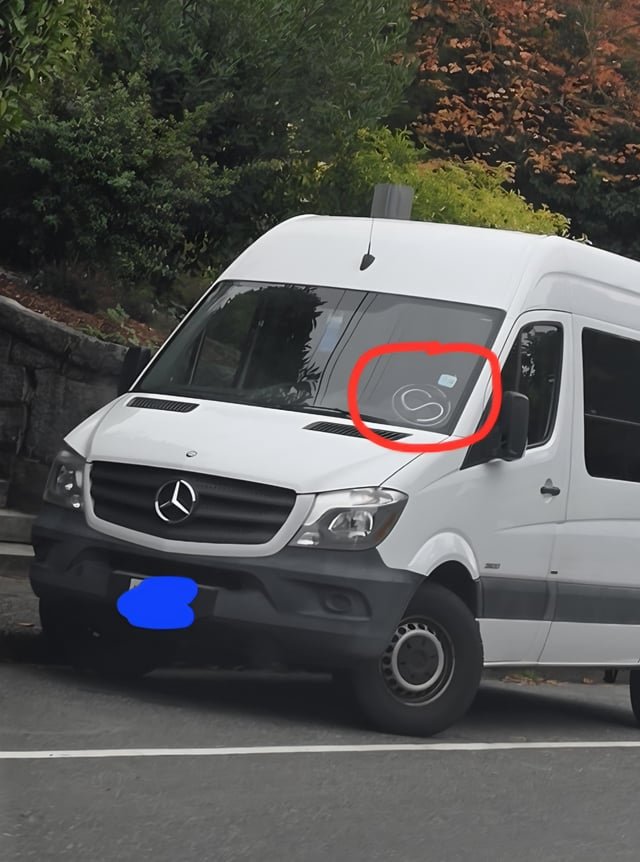 Can someone please tell me what this S in a circle on the bottom drivers side corner of a windshield means?