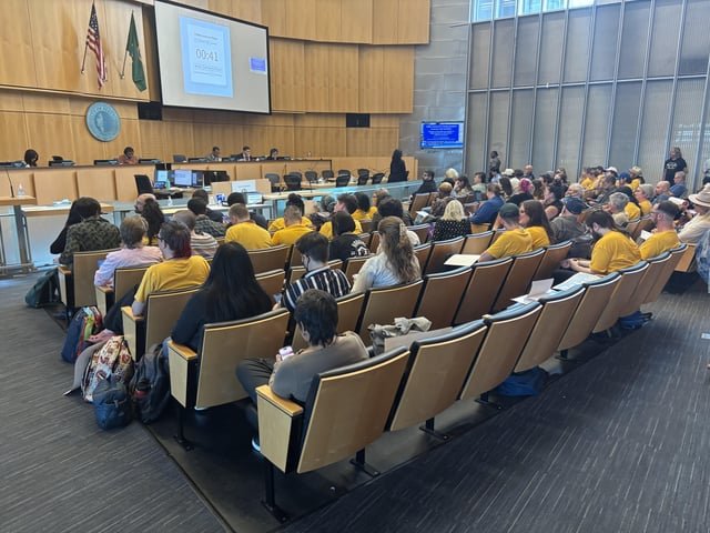 Seattle City Council chambers reasonably full of public commenters supporting Fair Pricing Ordinance