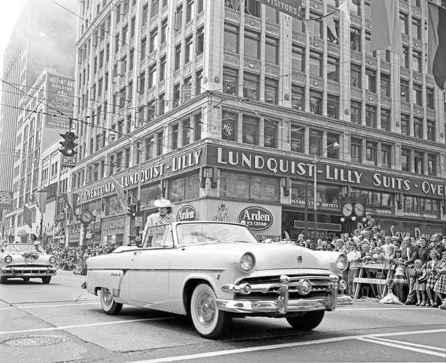 A Ford Crestline Sunliner convertible parading through downtown Seattle during the city’s Seafair Festival. Established in 1950 to promote tourism and celebrate Seattle’s maritime heritage, the event has been held annually ever since and has grown into a multi-week summer festival. (1954)
